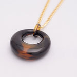 Round tortoiseshell pendant
