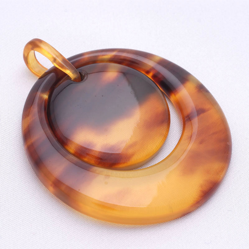 Round tortoiseshell pendant