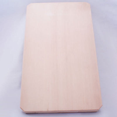 A cutting board made from a single piece of natural cypress